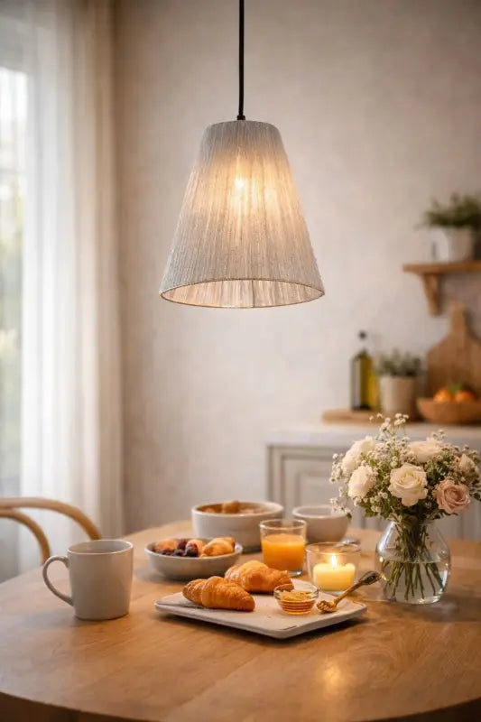 Dining table with a pendant light above.