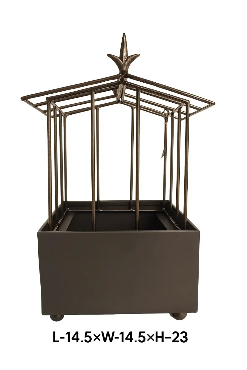 Decorative metal planter with star design on a white background