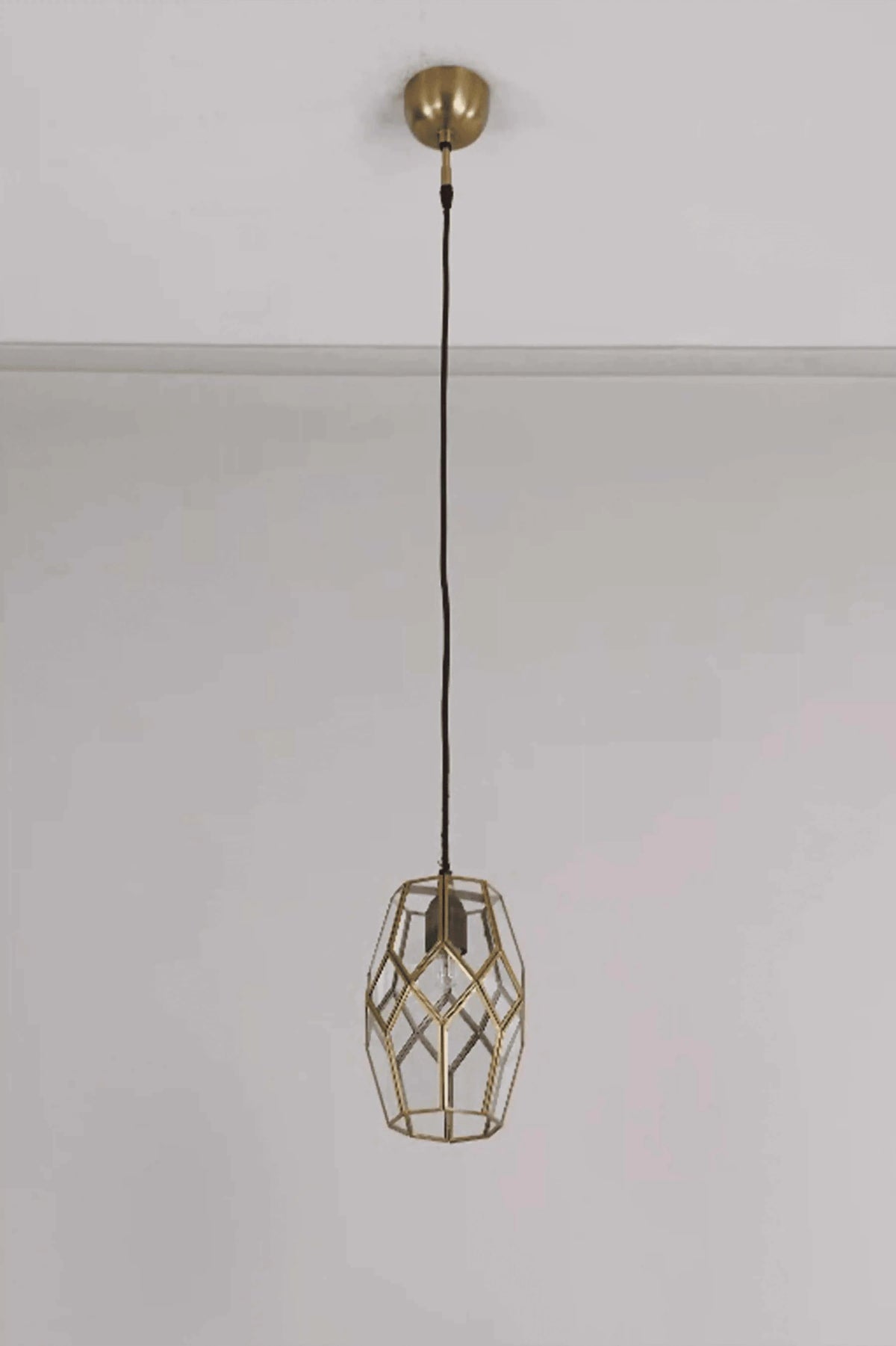 Geometric honeycomb clear glass pendant light with brass detailing and handcrafted stained glass design