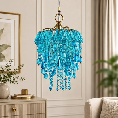 Decorative turquoise beaded pendant chandelier by ILLUMEA designed with cascading glass beads and antique gold accents for living rooms, entryways, bedrooms and hospitality spaces.