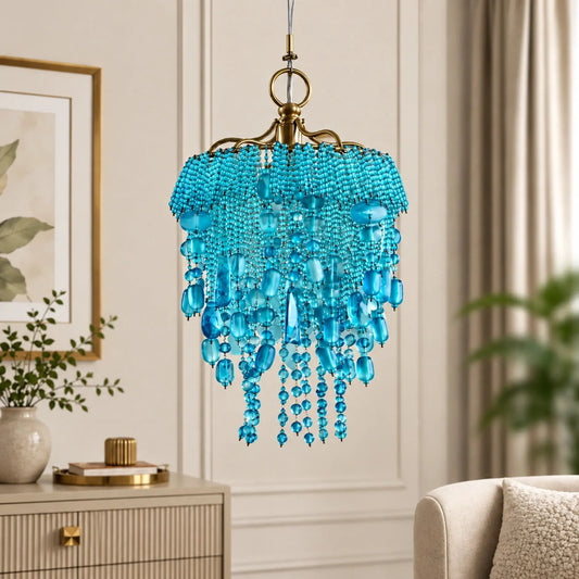 Decorative turquoise beaded pendant chandelier by ILLUMEA designed with cascading glass beads and antique gold accents for living rooms, entryways, bedrooms and hospitality spaces.