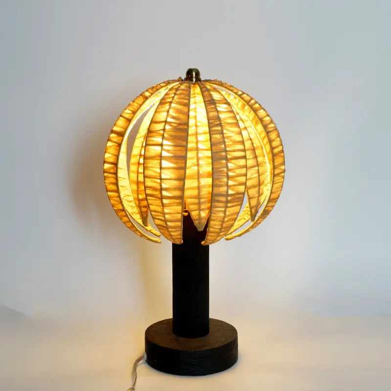 Table lamp with a unique design on a plain background