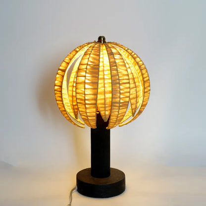 Table lamp with a unique design on a plain background