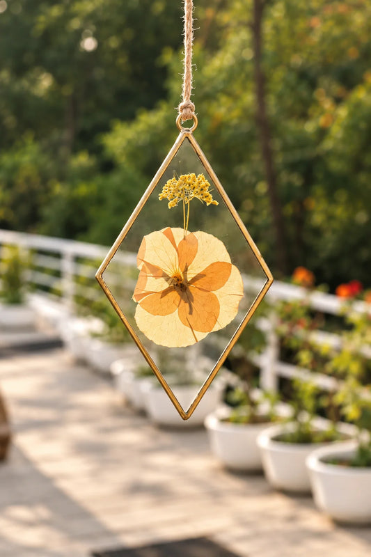 Diamond Dried Flower Suncatcher Pendant with preserved botanical flowers inside a clear glass frame and brass-toned edging – ILLUMEA