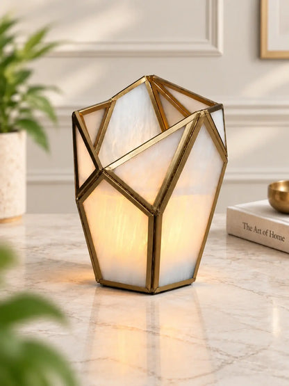 Geometric Tealight Candle Holder – ILLUMEA luxury decorative lantern featuring frosted white glass panels and an intricate brass geometric frame for elegant home décor