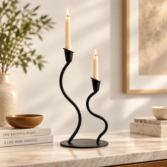 ILLUMEA Black Tealight Two Candle Holders featuring elegant curved stems and a round metal base for modern home décor