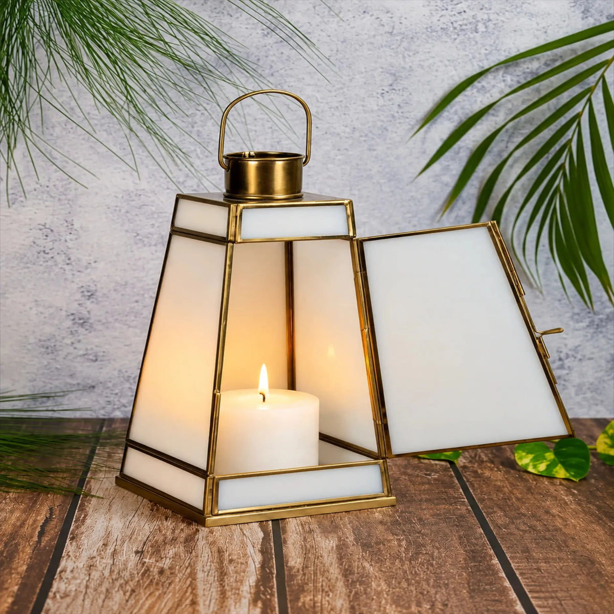 ILLUMEA white glass candle lantern featuring an antique brass frame, sturdy base and arched handle for elegant decorative lighting