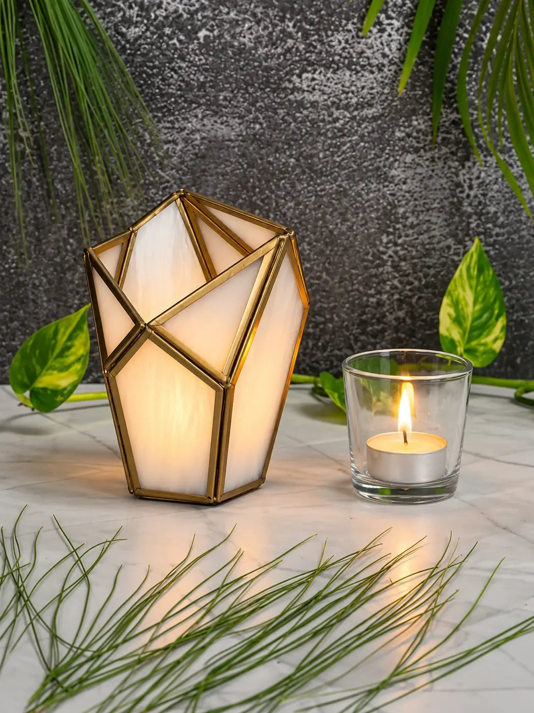 Luxury Geometric Tealight Candle Holder – ILLUMEA handcrafted glass lantern with faceted translucent panels and antique brass detailing, perfect for modern tables and interior styling