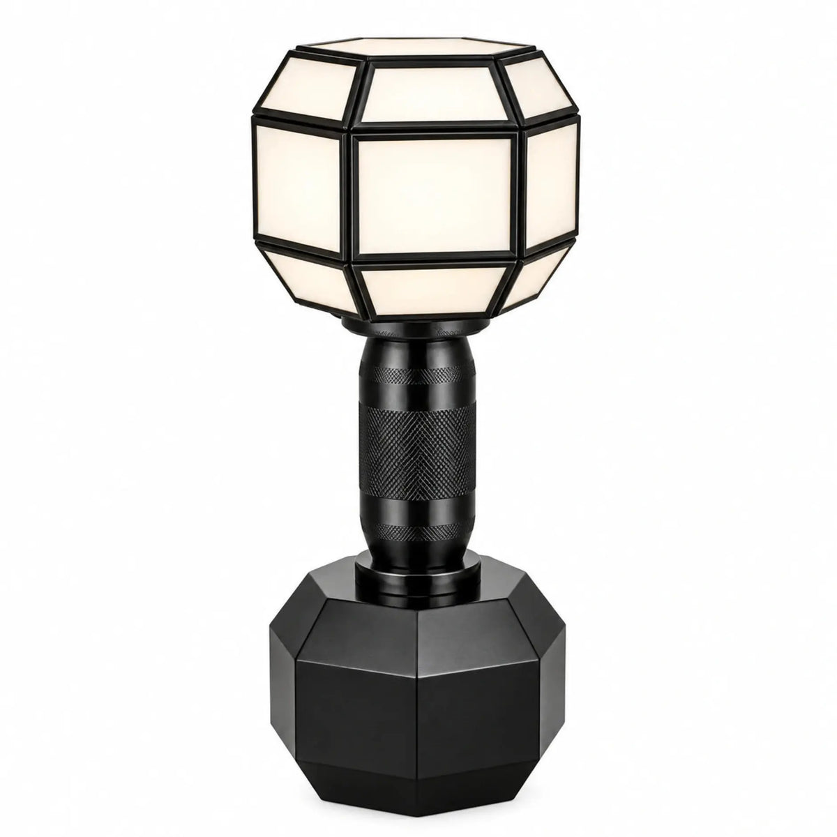 Modern geometric Dumble table lamp by ILLUMEA featuring a faceted shade, textured stem and sculptural black base