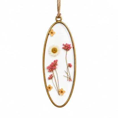 Elegant Pressed Flower Suncatcher Pendant featuring delicate dried botanicals and a handcrafted brass frame for window décor – ILLUMEA