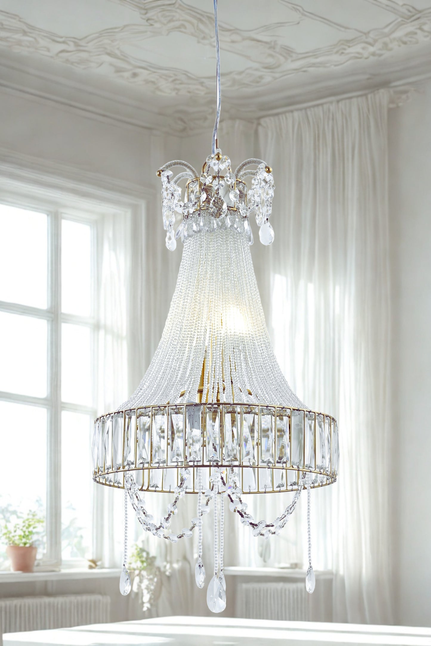 A luxurious crystal glass chandelier with a fluted glass body and hanging crystal beads, displayed in a bright room setting.