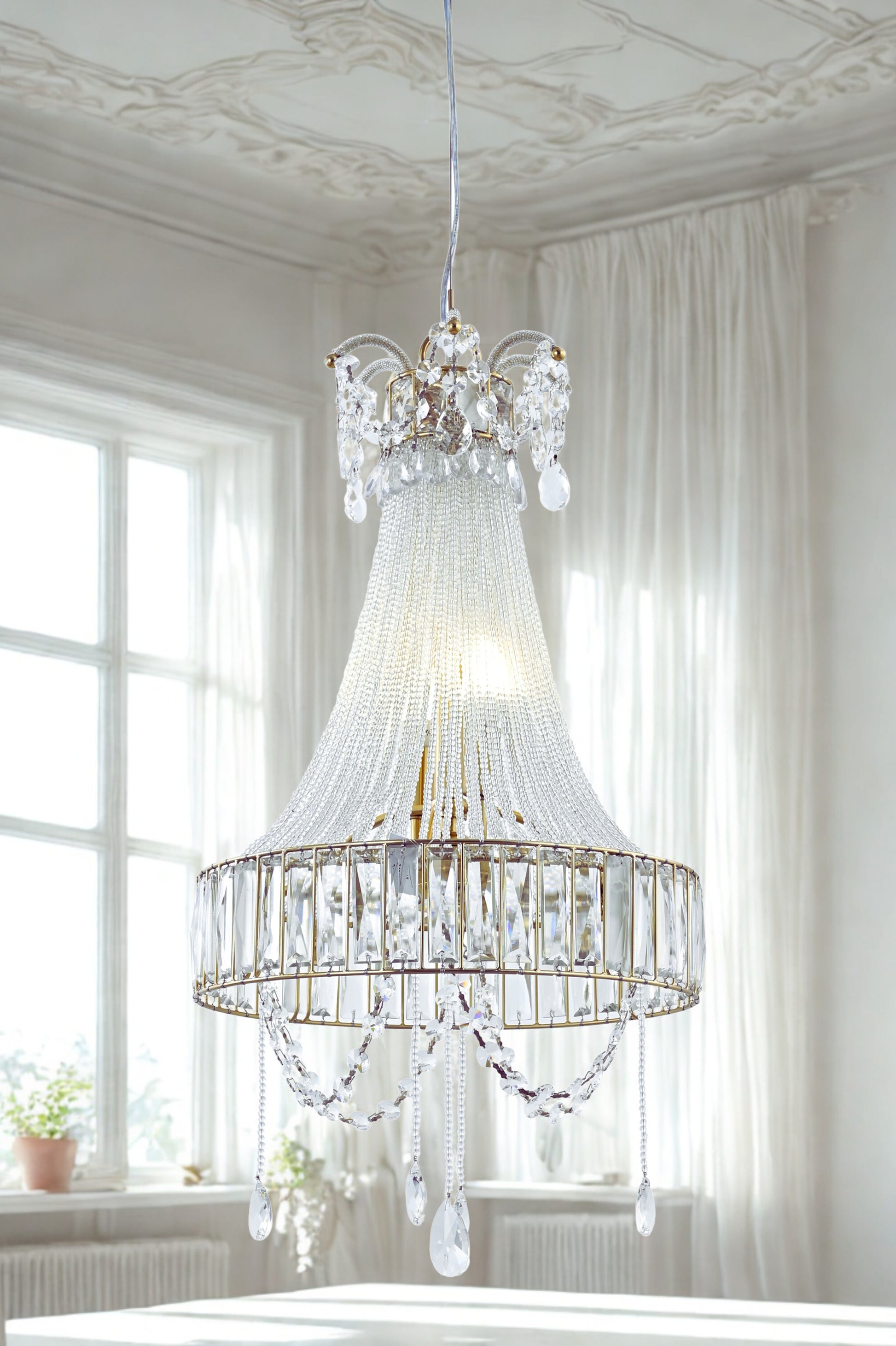 A luxurious crystal glass chandelier with a fluted glass body and hanging crystal beads, displayed in a bright room setting.