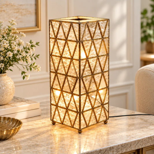 Triangle table lamp with brass frame and textured glass panels, designed for elegant living room and bedroom lighting – ILLUMEA
